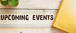 upcoming events displayed on wood surface