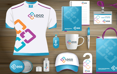 Promotional products such as athletic t-shirt, coffee mug, hat, buttons, stationery, lanyard, bag, and water bottle all with logo branding